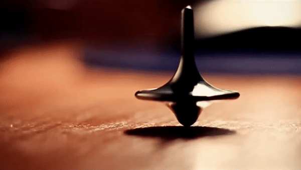 Blog - Endless AI Video Loop of a Spinning top totem. BOOCLE